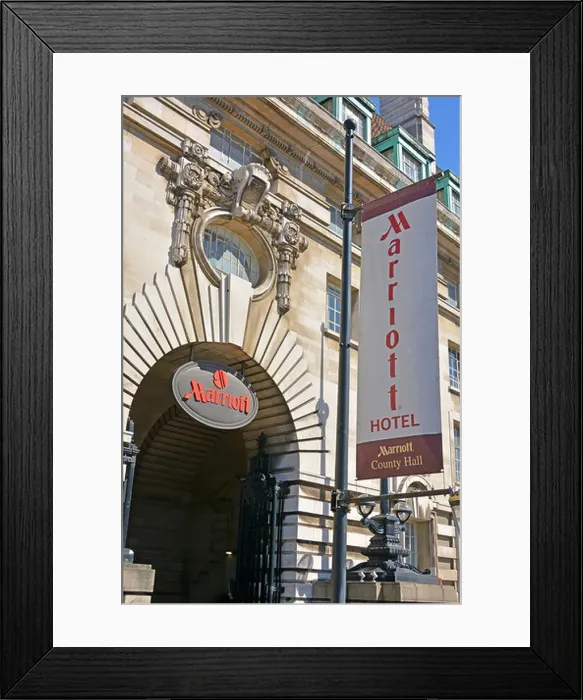 Framed Print : Close up Marriott Hotel sign & banner above entrance converted from part of old LCC & GLC office building at County Framed Print : Close up Marriott Hotel sign & banner above entrance converted from part of old LCC & GLC office building at County