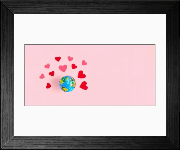 Framed Print : Spinning Earth with Hearts on beige pastel background Framed Print : Spinning Earth with Hearts on beige pastel background