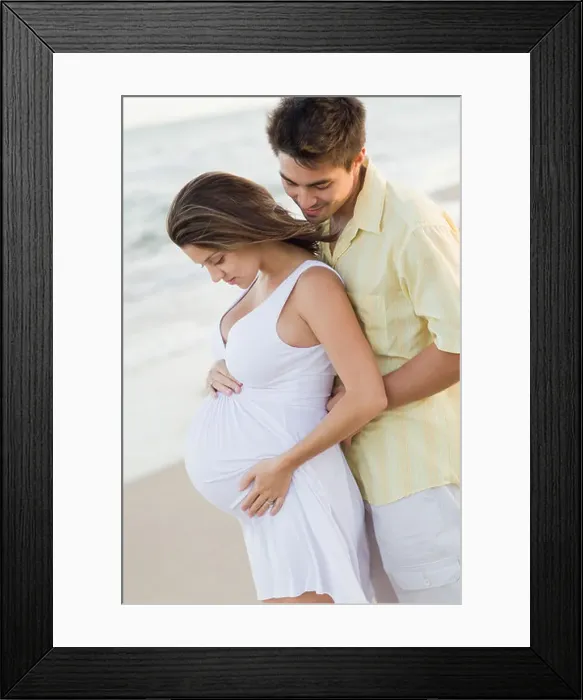 Framed Print : Husband hugging pregnant wife on beach Framed Print : Husband hugging pregnant wife on beach