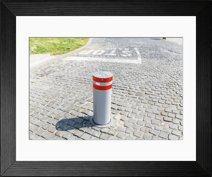 Framed Print : Automatic Pillar for fencing the Parking or blocking roads in modern city Framed Print : Automatic Pillar for fencing the Parking or blocking roads in modern city