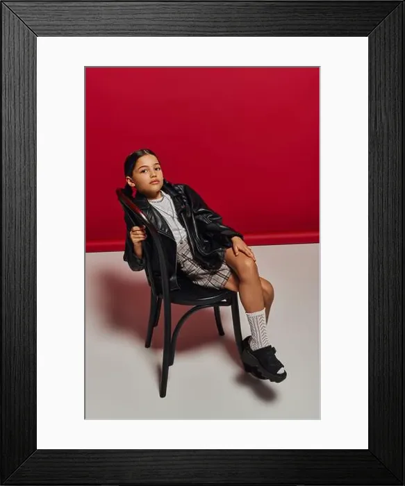 Framed Print : Full length of fashionable preteen girl with hairstyle posing in leather jacket Framed Print : Full length of fashionable preteen girl with hairstyle posing in leather jacket