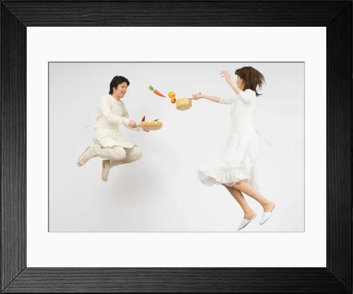 Framed Print : Couple holding flying pan