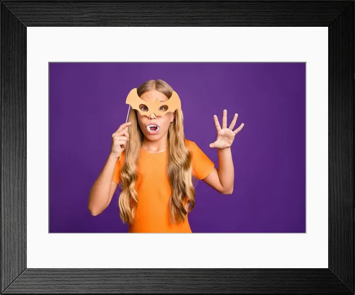 Framed Print : Photo of little vampire lady playing paranormal creature role halloween theme party holding bat paper stick mask wear