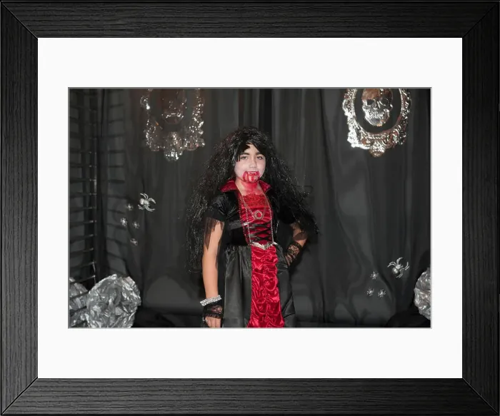 Framed Print : A girl having her picture taken on Halloween in Battery Park City, a neighborhood in New York City Framed Print : A girl having her picture taken on Halloween in Battery Park City, a neighborhood in New York City