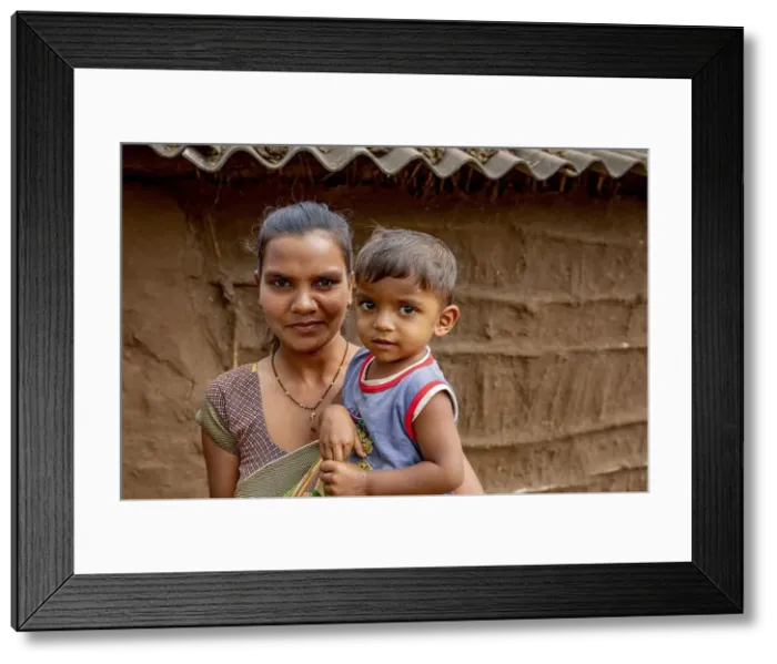Framed Print : Adivasi mother and son in a village in Narmada district, Gujarat, India Framed Print : Adivasi mother and son in a village in Narmada district, Gujarat, India