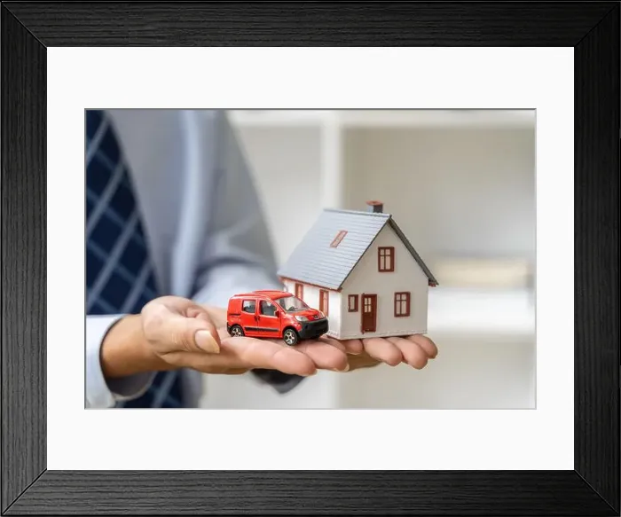 Framed Print : Close up hands of a male realtor holding a house and car model in his hands, home buying or real estate concept Framed Print : Close up hands of a male realtor holding a house and car model in his hands, home buying or real estate concept