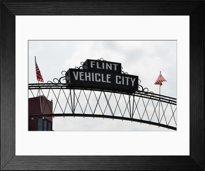 Framed Print : FLINT, MI - AUGUST 22: Flint Vehicle City sign, shown here on August 22, 2015, spans downtown Flint, MI Framed Print : FLINT, MI - AUGUST 22: Flint Vehicle City sign, shown here on August 22, 2015, spans downtown Flint, MI