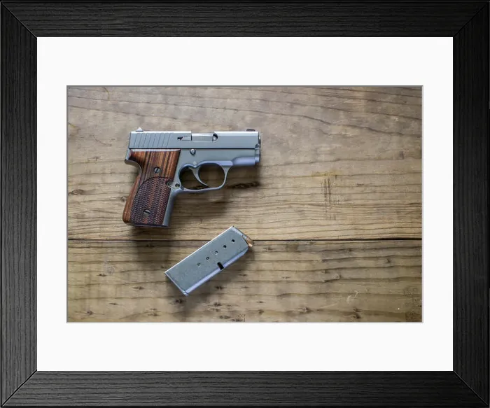 Framed Print : Stainless steel 9mm Pistol with magazine Framed Print : Stainless steel 9mm Pistol with magazine