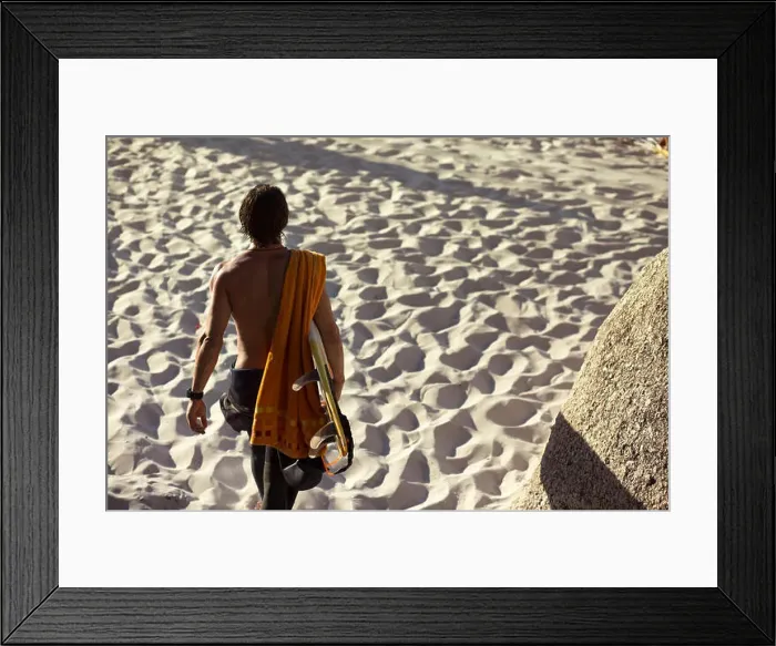 Framed Print : Mid adult male surfer carrying surfboard on beach, rear view, Camps Bay Beach, Cape Town, South Africa Framed Print : Mid adult male surfer carrying surfboard on beach, rear view, Camps Bay Beach, Cape Town, South Africa