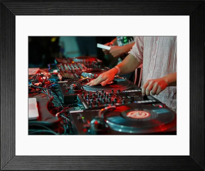Framed Print : Hip hop dj scratches vinyl record on party in night club Framed Print : Hip hop dj scratches vinyl record on party in night club