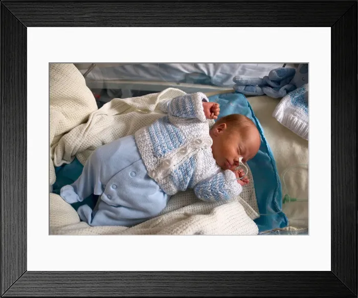 Framed Print : Premature newborn baby boy in hospital with a feeding tube attached to his nose Framed Print : Premature newborn baby boy in hospital with a feeding tube attached to his nose