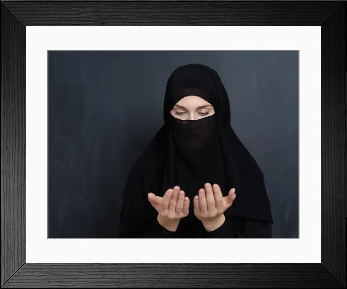 Framed Print : Portrait of young Muslim woman with niqab making dua Framed Print : Portrait of young Muslim woman with niqab making dua