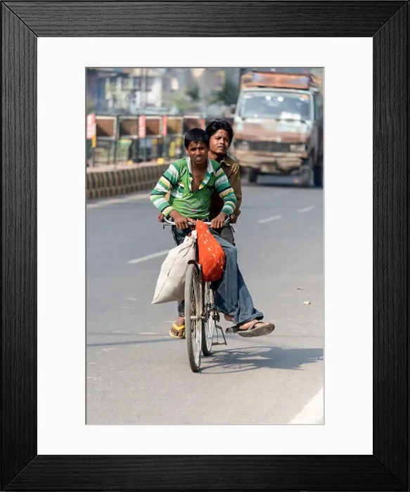 Framed Print : Two young boys riding on a bicycle on the main road in Agra, Uttar Pradesh.India Framed Print : Two young boys riding on a bicycle on the main road in Agra, Uttar Pradesh.India