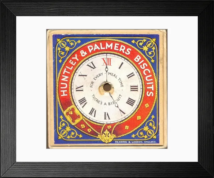 Framed Print : Chromolithographed advertising give away for Huntley & Palmers Biscuits circa 1895 showing a clock face with moveable Framed Print : Chromolithographed advertising give away for Huntley & Palmers Biscuits circa 1895 showing a clock face with moveable