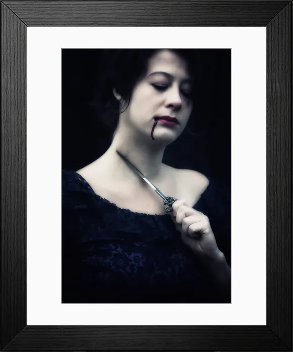 Framed Print : a woman in a dark dress is holding a dagger at her throat, having blood dripping out of her mouth Framed Print : a woman in a dark dress is holding a dagger at her throat, having blood dripping out of her mouth