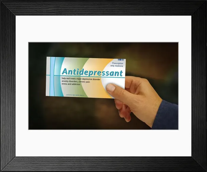 Framed Print : Antidepressant tablets box in hand Framed Print : Antidepressant tablets box in hand