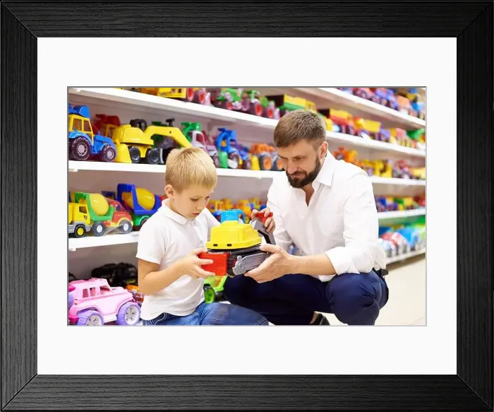 Framed Print : Father and son in a toy store Framed Print : Father and son in a toy store
