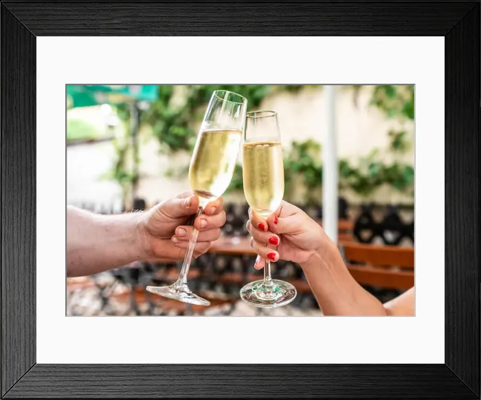 Framed Print : Celebration. People holding glasses of champagne making a toast Framed Print : Celebration. People holding glasses of champagne making a toast