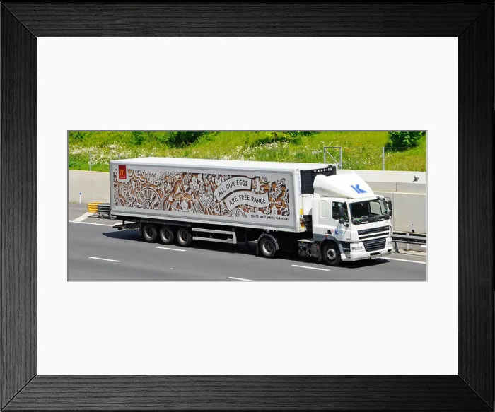 Framed Print : McDonalds advert for free range eggs on store supply chain delivery trailer behind lorry truck driving along UK m25 Framed Print : McDonalds advert for free range eggs on store supply chain delivery trailer behind lorry truck driving along UK m25