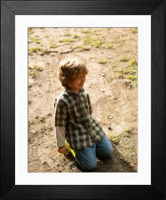 Framed Print : A toddler is falling down on the road Framed Print : A toddler is falling down on the road