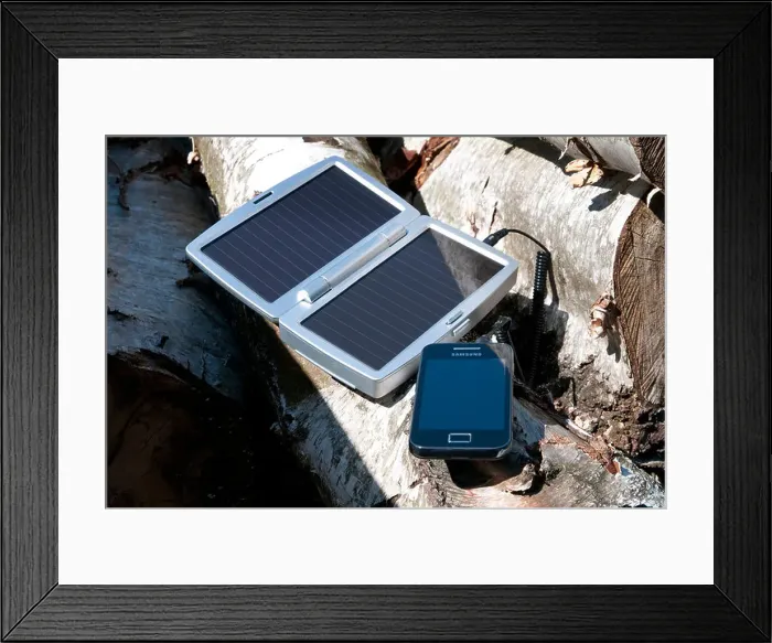 Framed Print : mobile phone solar powered battery charger