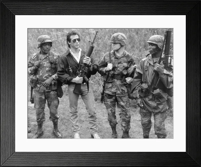 Framed Print : The actor Sylvester Stallone visits American troops in Berlin and appears, among others, with an M-16 assault rifle Framed Print : The actor Sylvester Stallone visits American troops in Berlin and appears, among others, with an M-16 assault rifle