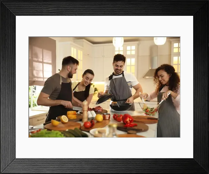 Framed Print : Happy people cooking food together in kitchen Framed Print : Happy people cooking food together in kitchen