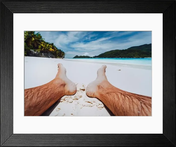 Framed Print : Male legs feet in focus. Enjoying relaxing at tropical paradise beach Framed Print : Male legs feet in focus. Enjoying relaxing at tropical paradise beach