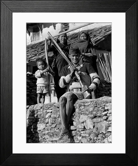 Framed Print : A Nepali man with an old rifle and his family in the middle hills village of Siklis - Nepal Framed Print : A Nepali man with an old rifle and his family in the middle hills village of Siklis - Nepal