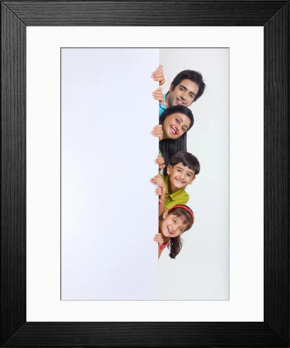 Framed Print : Portrait of family peeking behind white board Framed Print : Portrait of family peeking behind white board