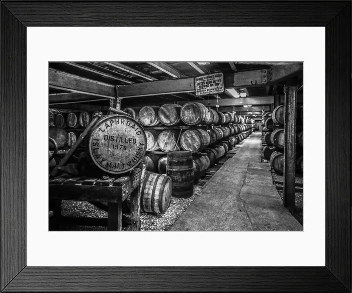Framed Print : Black and white image of whisky maturing in barrels at the renowned Laphroaig Distillery, Isle of Islay, Scotland Framed Print : Black and white image of whisky maturing in barrels at the renowned Laphroaig Distillery, Isle of Islay, Scotland