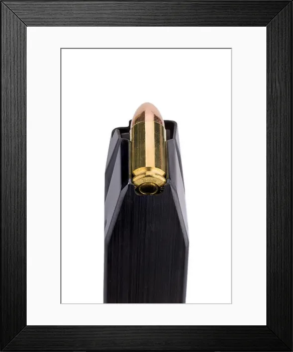 Framed Print : 9 mm pistol clip Framed Print : 9 mm pistol clip