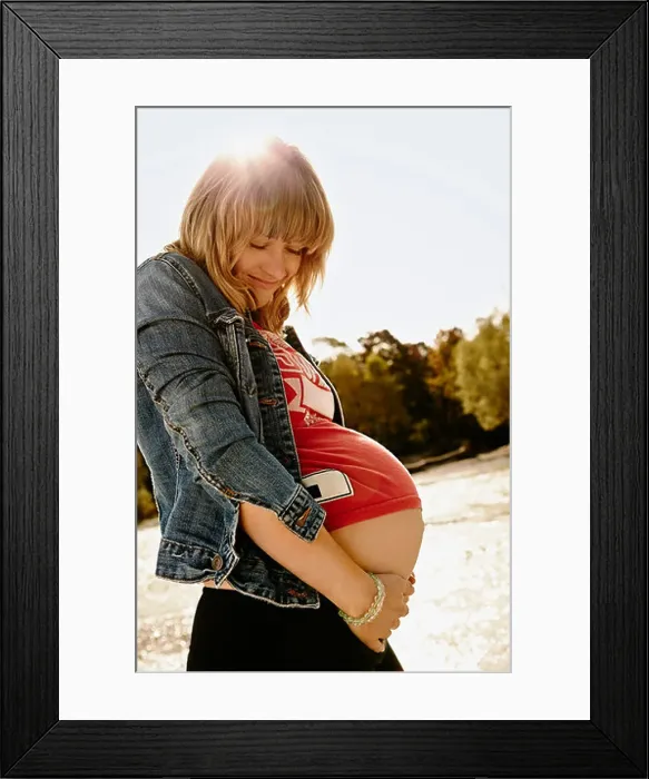 Framed Print : Portrait of pregnant woman looking down Framed Print : Portrait of pregnant woman looking down