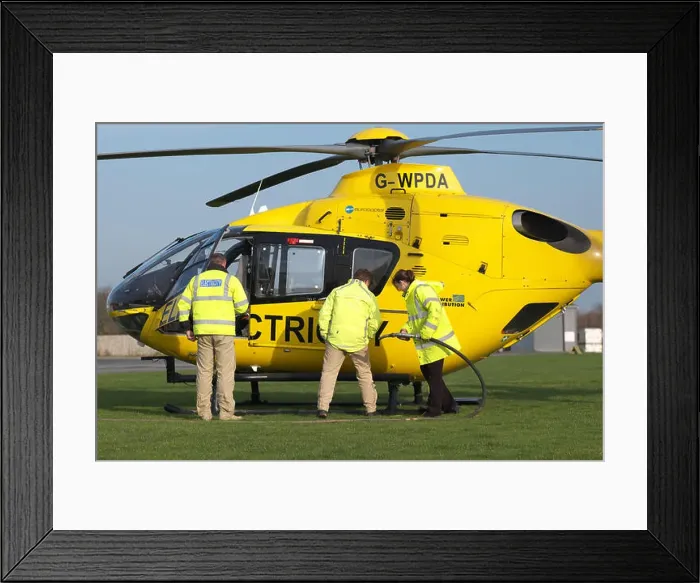 Framed Print : Eurocopter EC 135 helicopter used for electricity power supply checking by Western Power Distribution WPD in UK being Framed Print : Eurocopter EC 135 helicopter used for electricity power supply checking by Western Power Distribution WPD in UK being