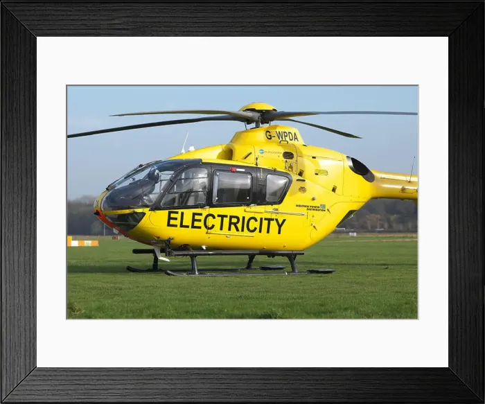 Framed Print : Eurocopter EC 135 helicopter used for electricity power supply checking by Western Power Distribution WPD in UK Framed Print : Eurocopter EC 135 helicopter used for electricity power supply checking by Western Power Distribution WPD in UK