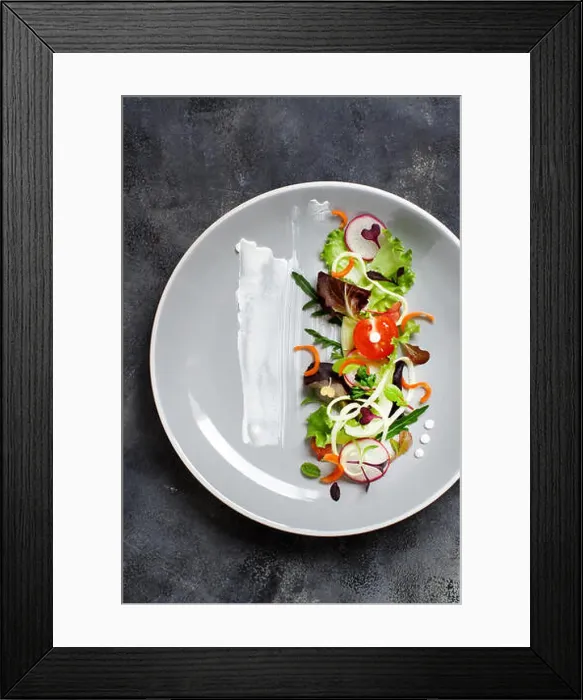 Framed Print : Green salad with microgreens on a black plate top view Framed Print : Green salad with microgreens on a black plate top view
