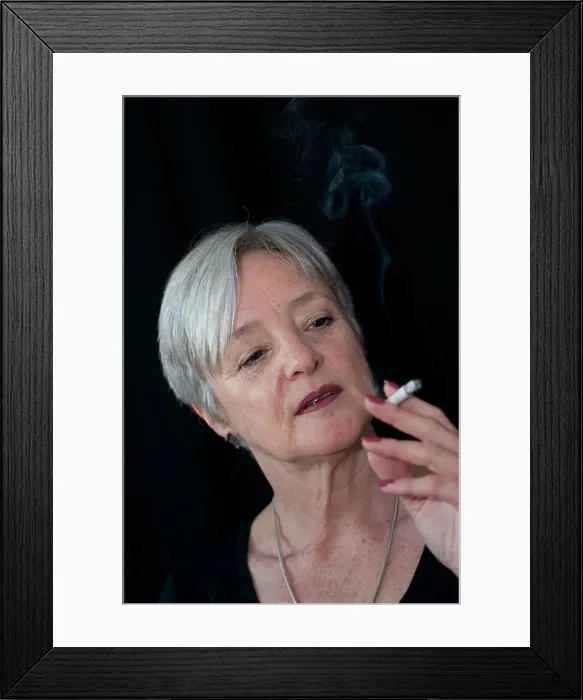 Framed Print : Middle aged woman smoking a cigarette Framed Print : Middle aged woman smoking a cigarette