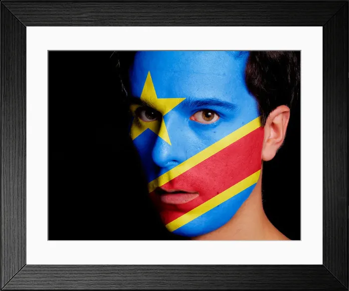 Framed Print : Flag of Democratic Republic of Congo Painted on a Face of a Young Man Framed Print : Flag of Democratic Republic of Congo Painted on a Face of a Young Man