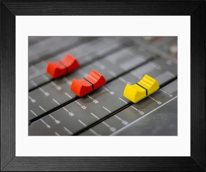 Framed Print : Sound control volume slide.Professional audio mixer in recording room Framed Print : Sound control volume slide.Professional audio mixer in recording room