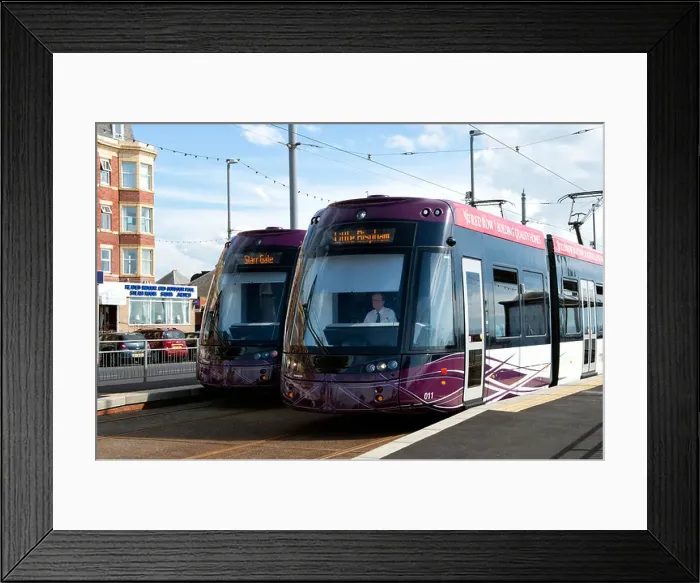 Framed Print : Two new style Blackpool trams pass each other in a station on the seafront in Blackpool, Lancashire Framed Print : Two new style Blackpool trams pass each other in a station on the seafront in Blackpool, Lancashire