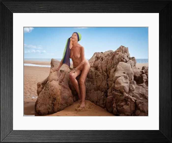 Framed Print : Mature nude woman at the beach
