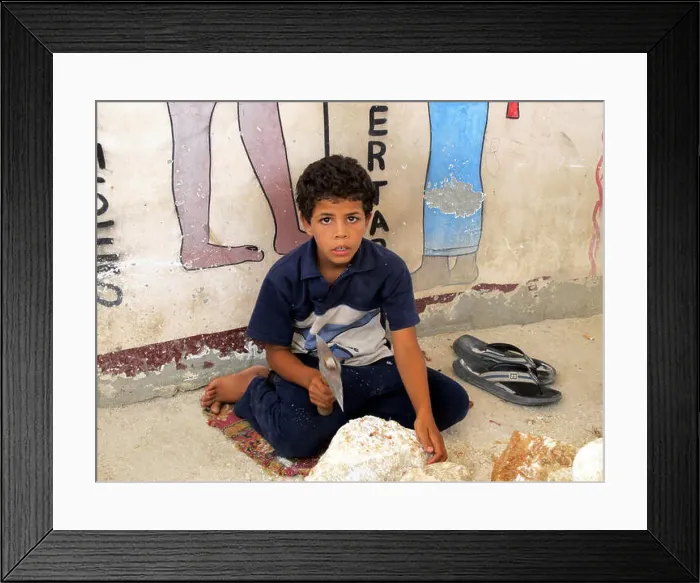 Framed Print : Egypt, Luxor - 07.26.2010: Poor Egyptian boy makes a stone workpiece Framed Print : Egypt, Luxor - 07.26.2010: Poor Egyptian boy makes a stone workpiece