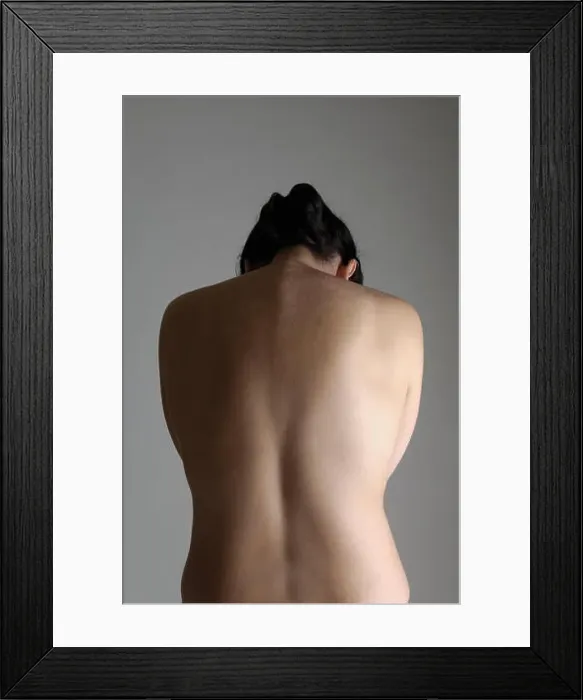 Framed Print : a woman on his back with gray background, head down Framed Print : a woman on his back with gray background, head down