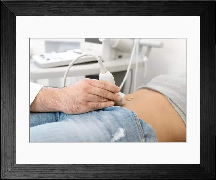Framed Print : Young woman having 4D ultrasound scan. Ultrasound imaging, examination of the abdomen Framed Print : Young woman having 4D ultrasound scan. Ultrasound imaging, examination of the abdomen