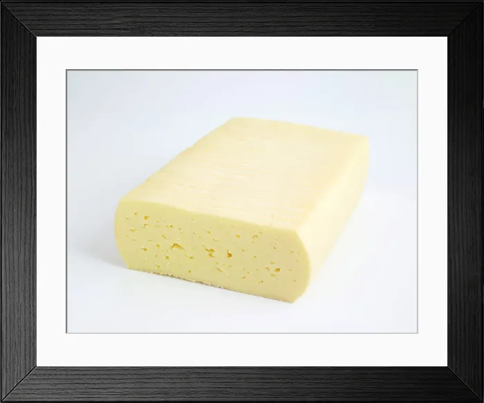 Framed Print : Danish Esrom cheese against white background Framed Print : Danish Esrom cheese against white background