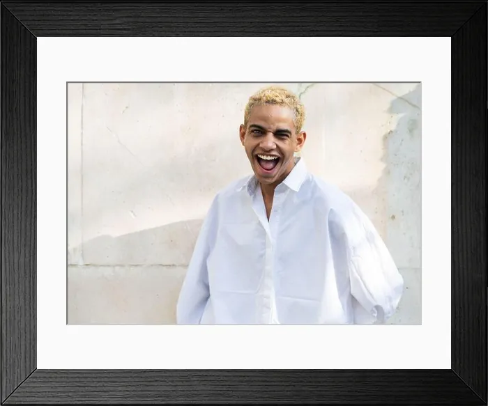 Framed Print : Portrait of beautiful modern young black man with blond hair looking to camera smiling and funny Framed Print : Portrait of beautiful modern young black man with blond hair looking to camera smiling and funny