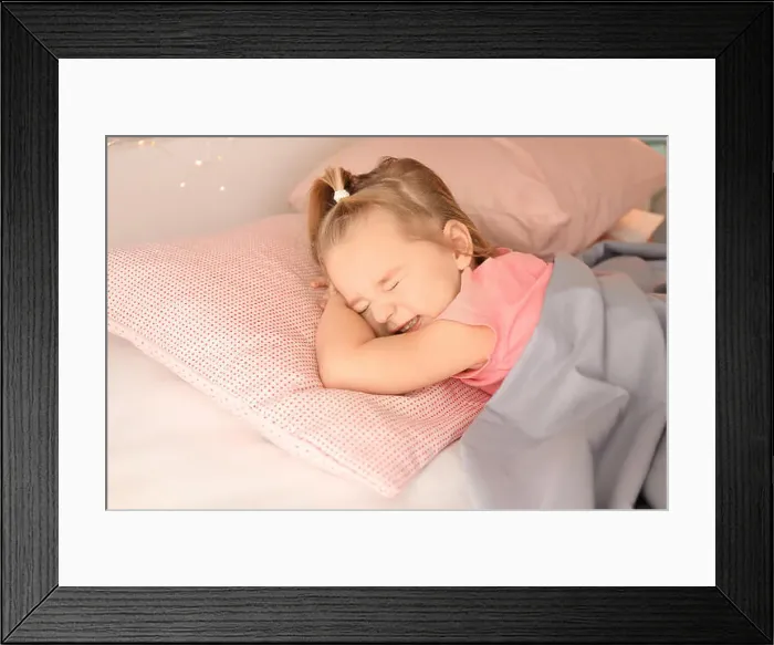 Framed Print : Little girl having bad dream while sleeping in bed at home Framed Print : Little girl having bad dream while sleeping in bed at home