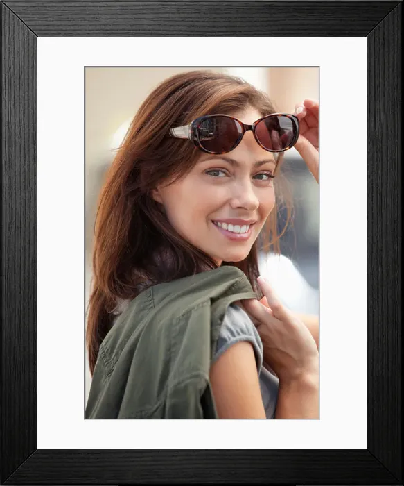 Framed Print : Portrait of a beautiful young woman wearing sunglasses Framed Print : Portrait of a beautiful young woman wearing sunglasses