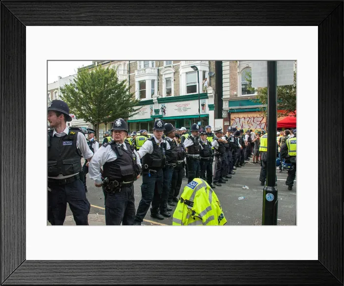 Framed Print : London, UK, 28 / 08 / 2017 Police move metal barriers after over crowding at corner of Ladbroke Grove and Lancaster Rd