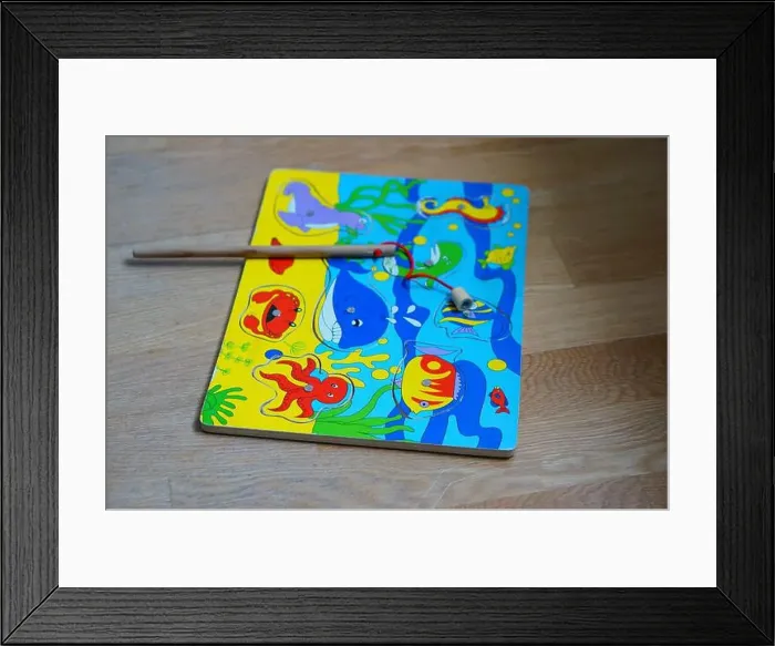 Framed Print : POZNAN, POLAND - Mar 07, 2016: A colorful wooden magnetic fishing puzzle with sea animal illustrations Framed Print : POZNAN, POLAND - Mar 07, 2016: A colorful wooden magnetic fishing puzzle with sea animal illustrations